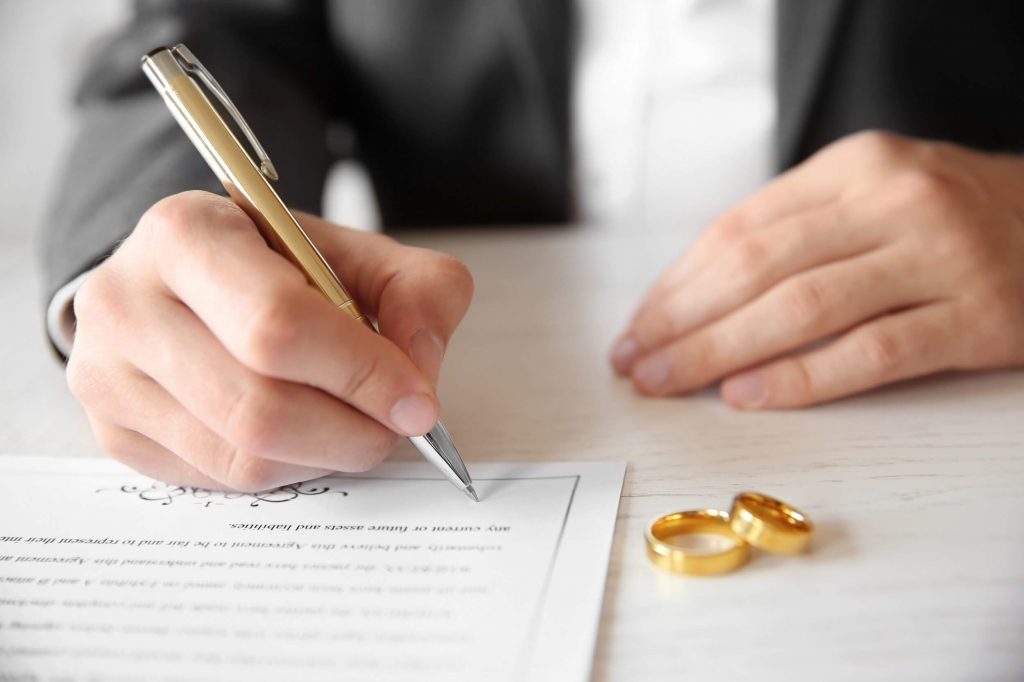 Man filing divorce forms in FL