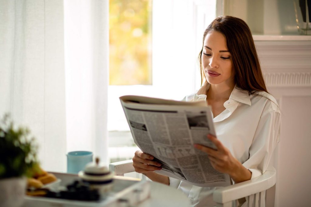 Woman reads about her divorce in newspaper in FL
